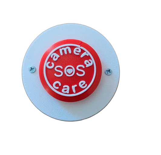 Camera Care bedside SOS button on a white wall plate
